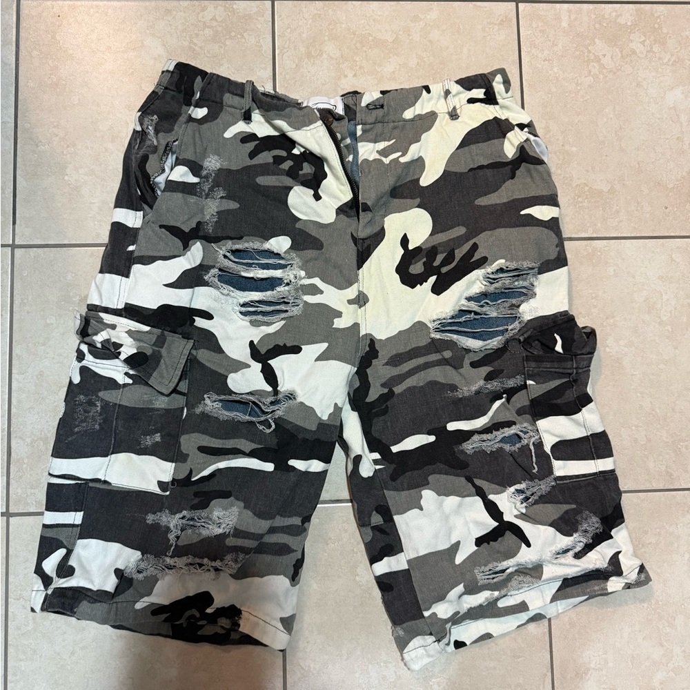 from the street camouflage shorts with a distressed look